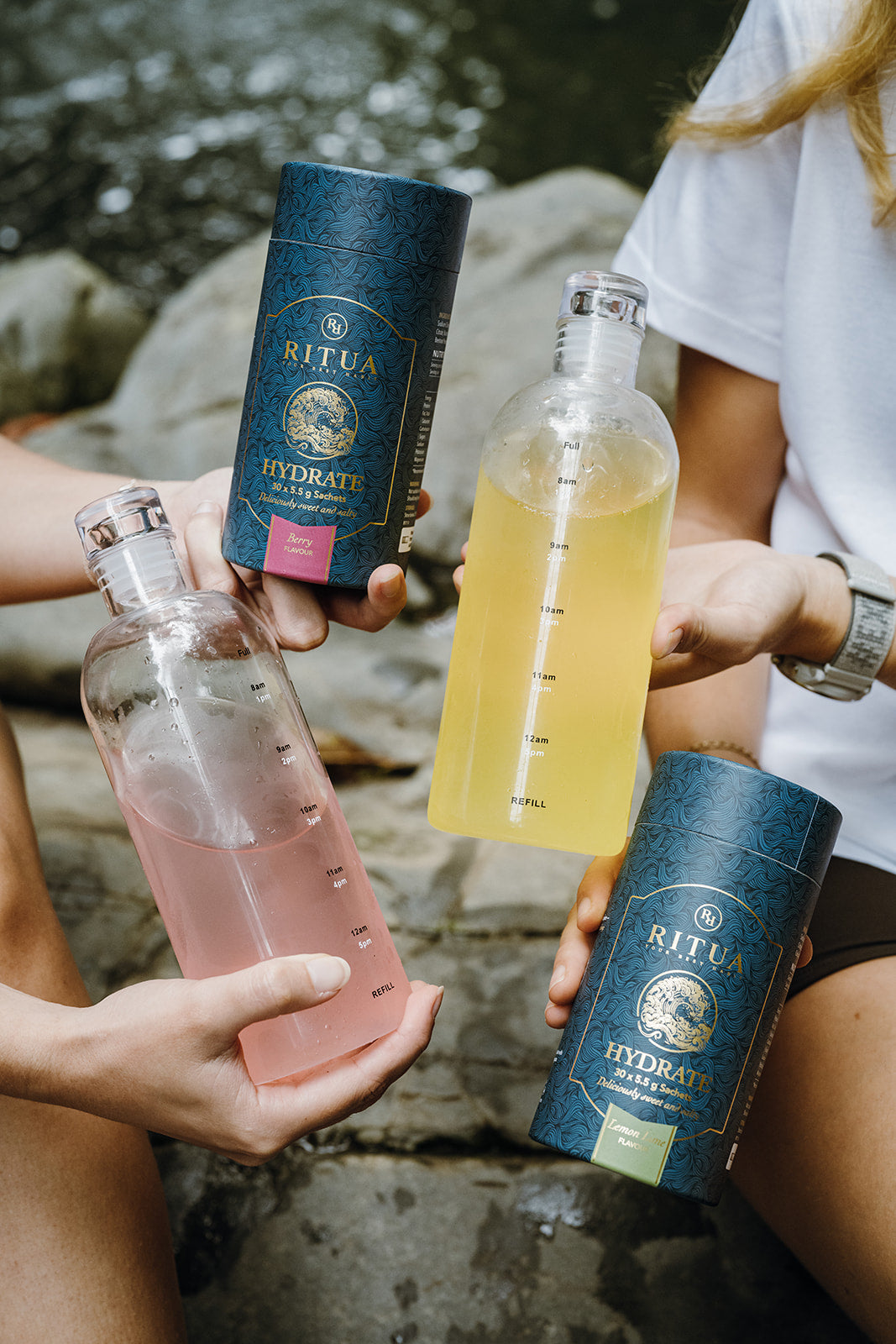 Berry and Lemon Lime Hydrate tubes held with mixed drink bottles