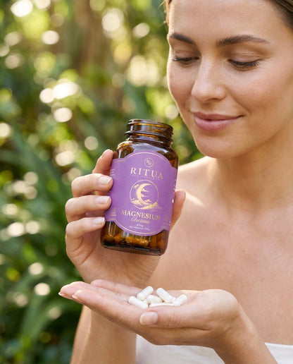Ritua Magnesium Glycinate capsules held in nature
