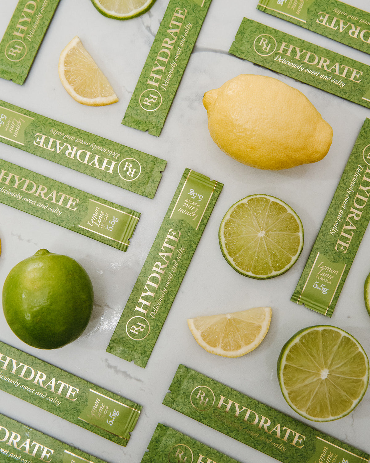 Ritua Hydrate Lemon Lime sachets with fresh lemon and lime