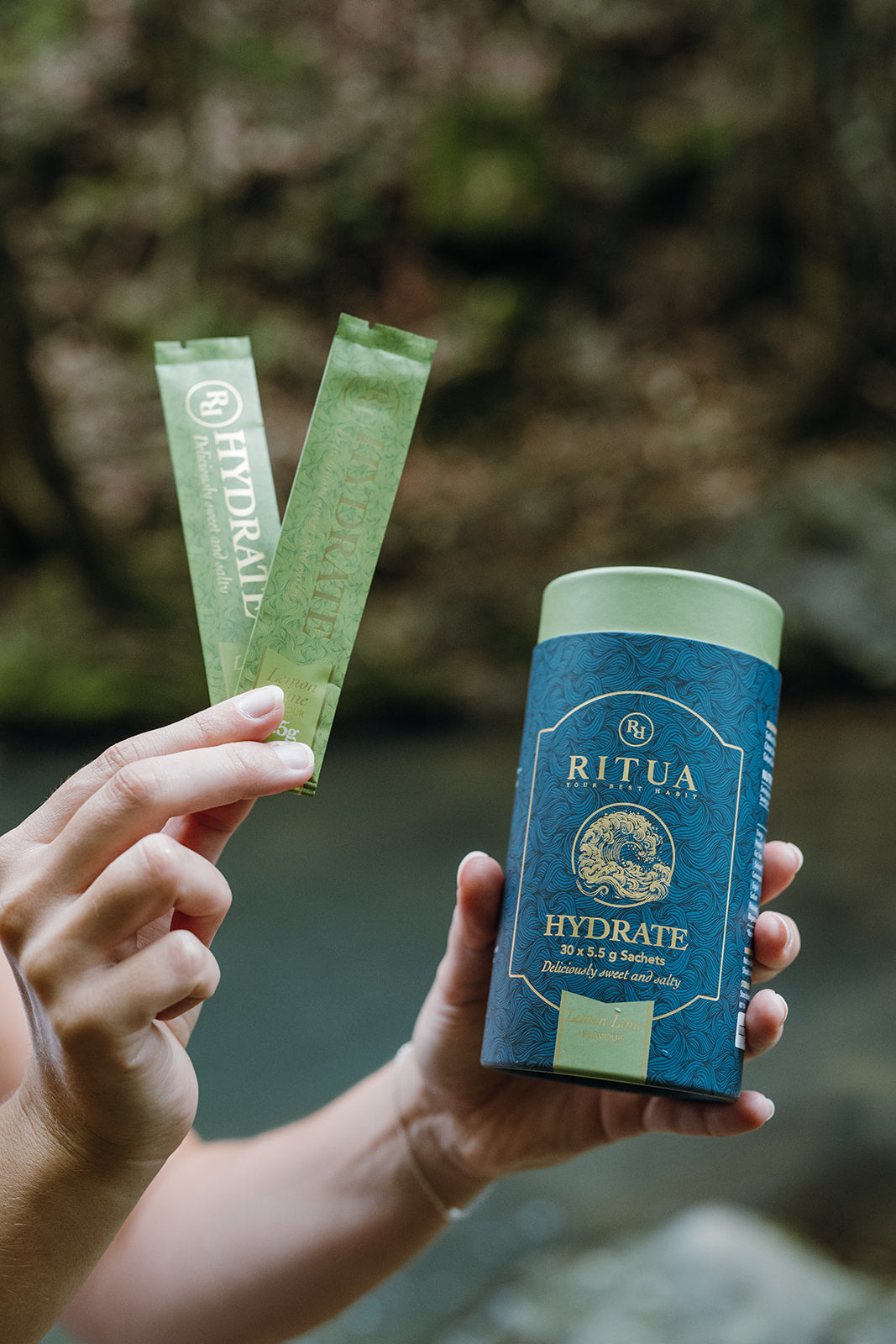 Ritua Hydrate Lemon Lime tube of 30 sachets held with two sachets
